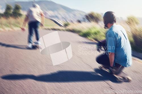 Image of Sports, skateboard and friends with speed in action on road ready for adventure, freedom and motion blur. Friendship, skateboarding and skaters with longboard for exercise hobby, skating and fitness