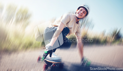 Image of Skateboard, blurred motion and fast with a sports man skating on an asphalt road outdoor for recreation. Skate, soft focus and speed with a male athlete or skater training outside on the street