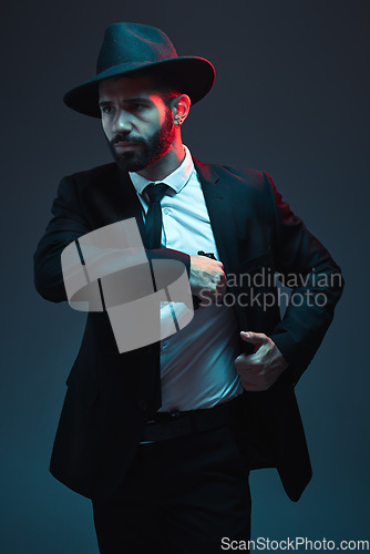 Image of Mafia, gangster and man in a classy suit for security business isolated on a dark background. Fashion, detective and professional, stylish and elegant bodyguard thinking of crime and agent work