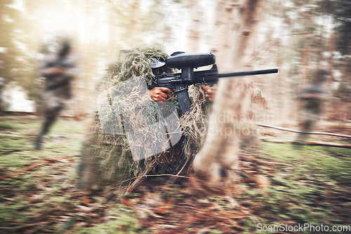 Image of Paintball gun, woods and man with aim by trees for outdoor war game, shooting strategy or spy in natural camouflage. Shooter, sniper or running for safety with eyes on target in military battle games