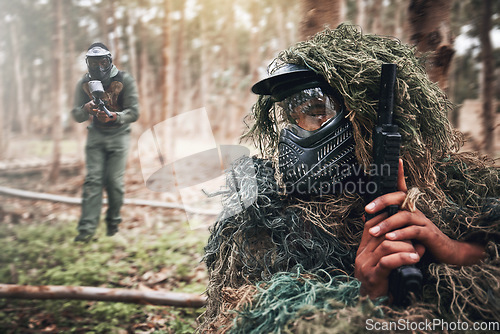 Image of Military, camouflage and people on a field playing paintball for exercise, fun and sport in Mexico. Fitness, action and person hiding while on battlefield for a game, competition or war with friends