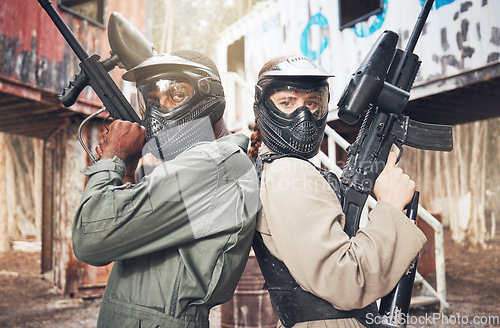 Image of Paintball, team and gun with solidarity and sports, game on battlefield with war, partnership and support in portrait. Motivation, mask for safety, people on shooting range with trust and confidence