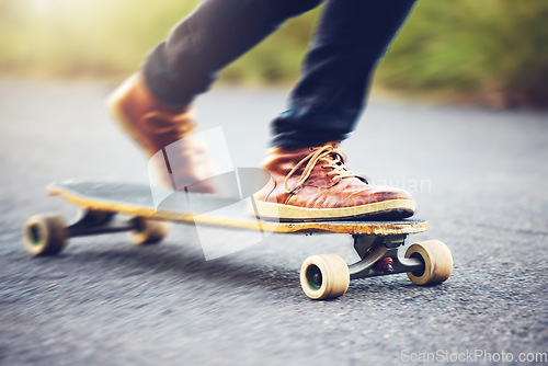 Image of Street, shoes on skateboard and longboard skating at skatepark with speed, skill and balance on road. Freedom, urban fun and gen z skateboarder hobby, legs and skate trick skateboarding for transport