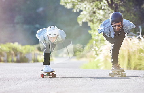 Image of Friends, speed and longboard skating in road, racing downhill with skateboard and helmet for safety. Extreme sports adventure, skateboarding street race and skateboarder ride on mountain pass.