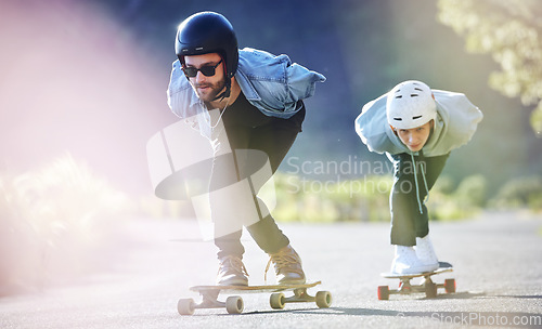 Image of Sports, speed and safety, longboard skating in road, friends racing downhill with skateboard and helmet. Extreme sport adventure, skateboarding street race and skateboarder riding on mountain pass.