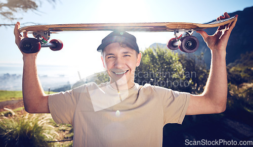 Image of Sports, skateboard and portrait of man on mountain for adventure, freedom and ready for skateboarding. Fashion, fitness and face of skater smile with longboard for exercise, skating and training