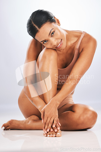 Image of Skincare, portrait and black woman in studio floor for dermatology, wellness and grey background. Beauty, african female and model with healthy, smooth and soft skin on backdrop for body cosmetics