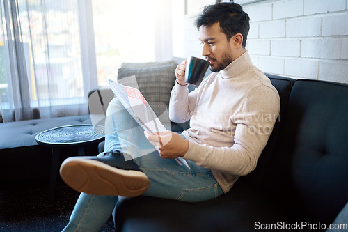 Image of Relax and reading newspaper by man with coffee or drinking tea in a home, house or apartment on weekend. Mexican, news and young person enjoying free time with an article, story or paper