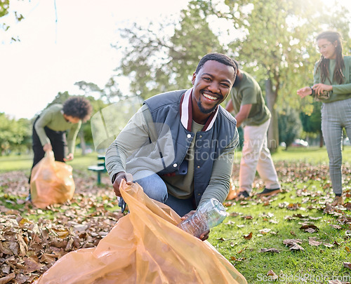 Image of Trash, volunteer portrait and man cleaning garbage pollution, waste product or African environment support. Plastic bottle container, NGO charity and nature park clean up by eco friendly community