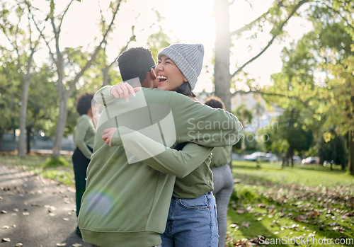 Image of Hug, friends and happy volunteer people outdoor at nature park with care for earth. Woman and man team together for community service in green ngo tshirt for recycling, cleaning and clean enviroment