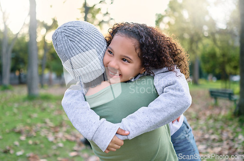 Image of Nature, love and child hugging mother in park with smile on autumn morning for family outdoor time together. Hug, play and laugh, mom and small girl in garden having fun at picnic or forest walk.