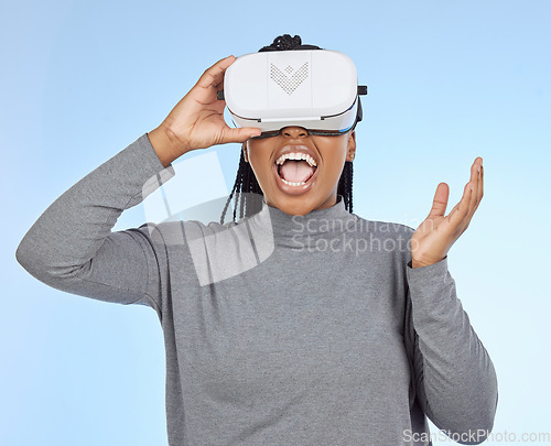 Image of Happy, gaming and vr with black woman and headset in metaverse for future, cyber or 3d system. Media, ui and technology with gamer for internet, augmented reality or digital in blue background studio