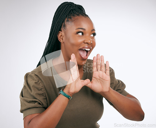 Image of Wow, announcement and excited with a black woman in studio on a gray background to share news. Hands, promotion and information with a young female indoor sharing a secret as a brand ambassador