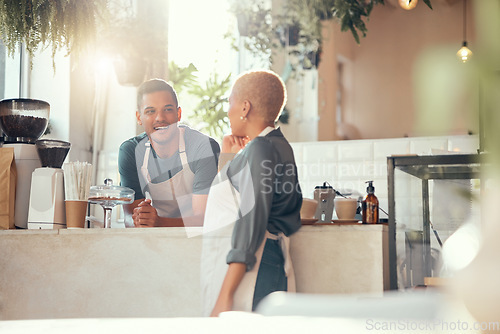 Image of Coffee shop, barista and team with small business and entrepreneur, employees chat while working and server. Entrepreneurship, food industry and team with communication, man and woman talking in cafe