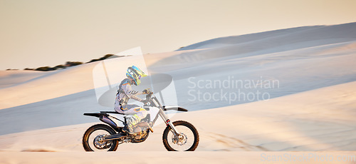 Image of Moto cross, sand mountain or man on bike in Dubai for sport workout, sunset ride or exercise on hill. Nature, sky or person riding for speed adventure freedom in desert for training, fitness or race