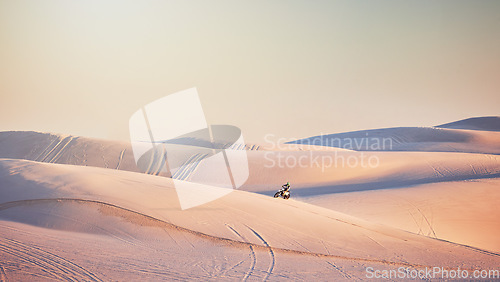 Image of Motorcycle, Dubai desert or man on bike for sport workout, sunset ride or exercise on hill. Nature, sky or male riding for speed adventure freedom in sand landscape training, fitness or sports race