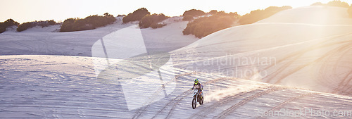 Image of Motorcycle, sand hill or man on bike in flare lens for sport workout, sunset ride or exercise wellness. Nature, sky or male riding for speed adventure in Dubai desert for training, fitness or race