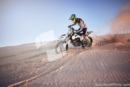 Image of Moto cross, Dubai desert or man on bike stop for sport workout, sunset ride or exercise on hill. Nature, sky or person on motorcycle freedom adventure in sand for training, fitness or race sports