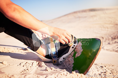 Image of Sand board, adventure and man with shoes for desert surfing, extreme sports and action hobby in nature. Freedom, holiday travel and feet of dune surfer outdoors for fitness, exercise and training