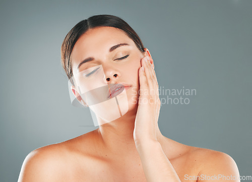 Image of Face, woman with eyes closed, skin and content with beauty and facial treatment, peace isolated on studio background. Natural cosmetics, dermatology glow with shine and skincare with wellness mockup
