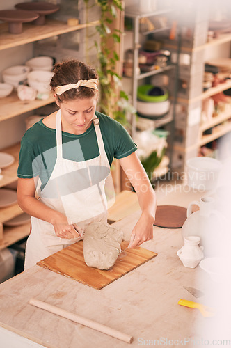 Image of Pottery, creative and small business with a woman designer working in her studio for art from above. Manufacturing, startup and scupture with a female entrepreneur, employee or artist in a workshop