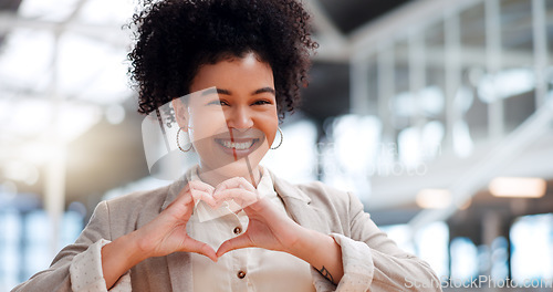 Image of Black woman with hand heart, face and career love, happy with corporate business and professional success. Modern office, happiness and vision, sign with hands and pride in job, portrait in workplace