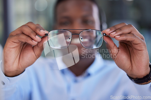 Image of Businessman, cleaning glasses and office for healthy vision, smile or happy for clear eyesight. Black man, hands or fashion spectacles for african corporate worker with excited happiness at workplace