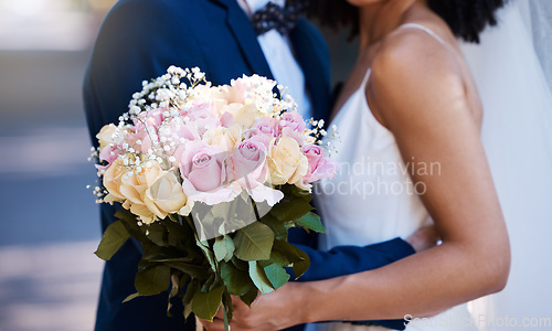 Image of Flowers, wedding or marriage with a bride and groom outdoor together after a ceremony of tradition or celebration. Bouquet, reception or commitment with a married couple outside as husband and wife