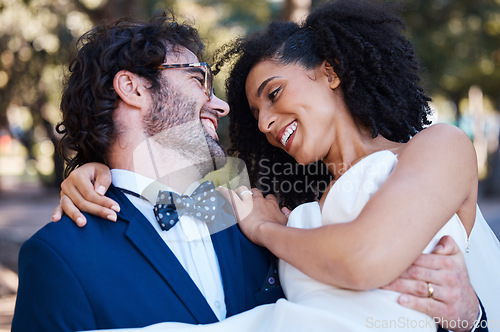 Image of Happy couple, wedding and carrying bride outdoor at marriage celebration event with love. Interracial man carries woman in arms at park for care, partnership and support with a smile while walking