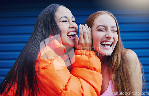 Image of Gossip, women talking and friends, laughing and reunion, bonding and blue wall background. Ladies, happy females and girls outdoor, quality time and conversation for funny, silly story and carefree