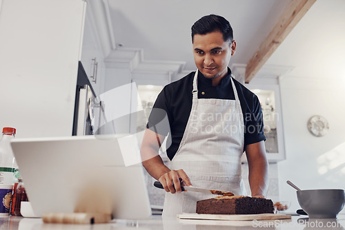 Image of Man, tablet and baking cake recipe in kitchen for birthday party or celebration. Young chef, reading cooking website and bake dessert product on counter for wellness on digital tech device