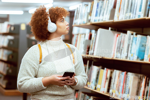 Image of Books, phone or student in a library to search for knowledge or university education for future growth. Scholarship, radio music or school girl in headphones studying or learning college information