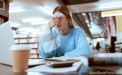 Image of Woman student, fatigue with headache and university burnout, stress for paper deadline or study for exam in library. Campus, college and tired studying with scholarship problem and mental health pain