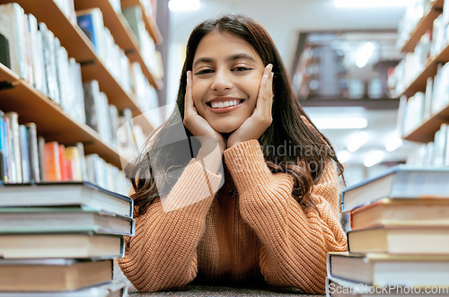 Image of Indian woman, portrait and library for studying, higher education or knowledge for exam, test or learning. Hobby, female student or academic with books, relax or college for scholarship or university