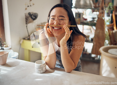 Image of Happy woman, portrait or pottery paintbrush in product design ideas, funny painting vision or creative studio color. Smile, clay or art paint worker in small business goals or Asian ceramic workshop