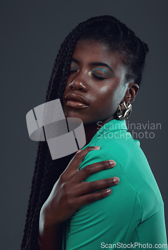 Image of Black woman, fashion and makeup in studio for beauty, wellness or cosmetics for skincare glow by background. African gen z model, cosmetic or edgy hipster clothes for pride, satisfaction or self love