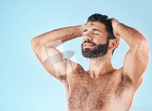 Image of Grooming, hair and hygiene with a man model washing in the shower for hydration or cleaning. Water, body and haircare with a handsome male using keratin treatment in the bathroom for personal care