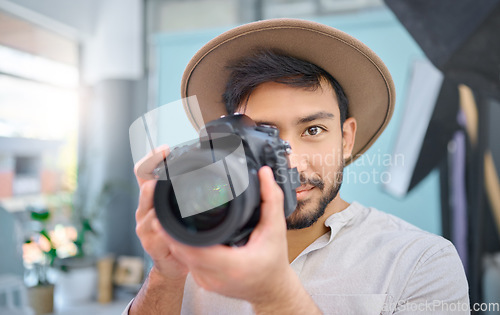 Image of Camera, portrait and photographer man in studio for photo shoot, creative and confident, professional and setup. Magazine, photography and face of asian male taking pictures, photo and backstage