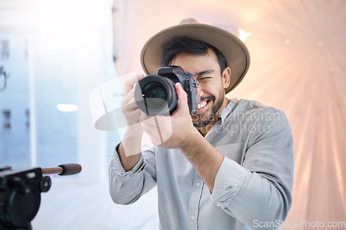 Image of Photographer, camera and man in studio for photoshoot, creative and happy on space, mockup and background. Magazine, photography and backstage shooting professional male having fun session in Japan