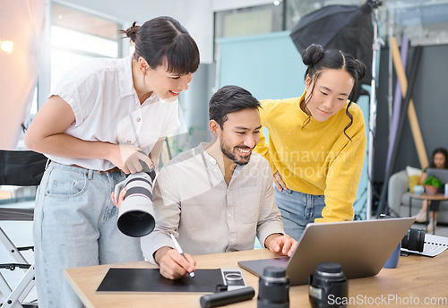 Image of Photographer, collaboration and laptop with a designer team working on a photoshoot in the studio. Photography, teamwork or computer with a man and woman creative group for a post production edit