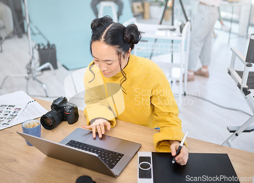 Image of Graphic tablet, laptop and photography woman editing photoshoot, focus on digital art or retouching artistic photo. Design pen, creative and top view of Asian photographer working on camera process