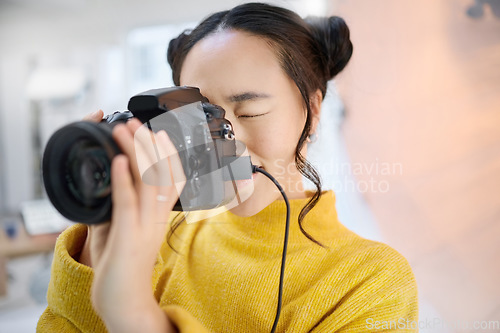 Image of photography, camera and woman in studio shooting creative memory picture, photoshoot or digital production. Lens focus, art creativity and young Japanese photographer girl working for artistic shot