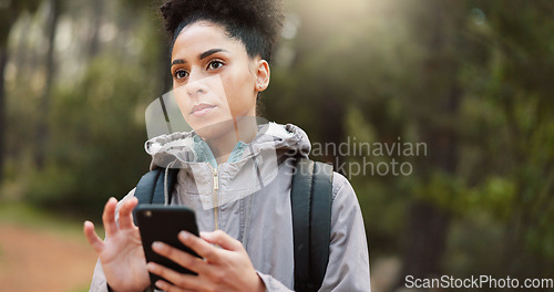 Image of Phone, hiking and female in nature for a gps location, travel and freedom in mountains of Peru during a holiday. Young, thinking and black woman with a mobile for communication while trekking in a fo