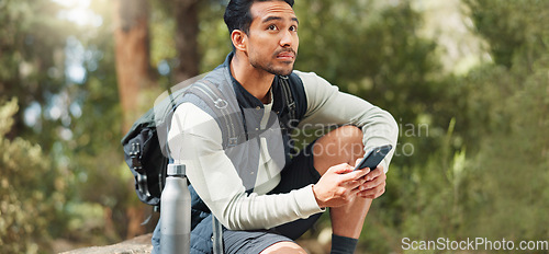 Image of Phone, hiking and man in nature for a gps location, travel and freedom in mountains of Peru during a holiday. Young, thinking and Asian man with a mobile for communication while trekking in a forest