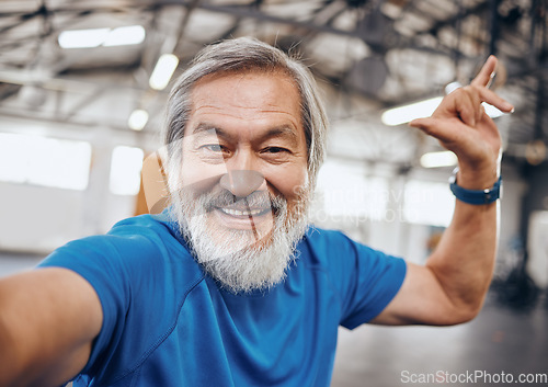 Image of Fitness, selfie and portrait of Asian man in gym with hand sign for motivation, wellness and cardio workout. Smile, healthy body and face of senior male after training, exercise and sports goals