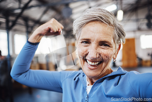 Image of Senior woman, flexing and smile for selfie or profile picture in exercise, workout or muscle training at the gym. Portrait of happy elderly female in fitness smiling for vlog, social media or post