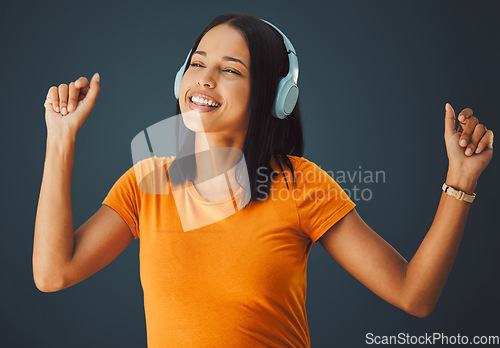 Image of Dance, black woman or headphones for music, happiness or girl on dark studio background. Dancing, African American female, girl or wireless headset for radio, streaming or listen to audio on backdrop