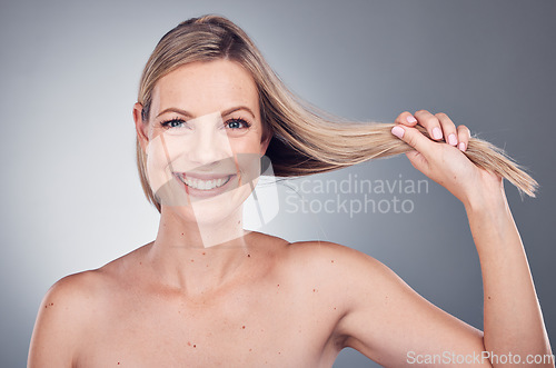 Image of Hair care, health and portrait of a woman in a studio with a keratin, botox and brazilian hair treatment. Happy, wellness and female model with a long, healthy and shiny hair style by gray background