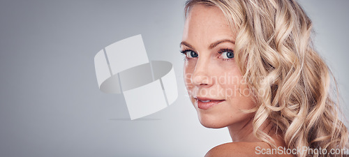 Image of Woman, beauty and portrait smile on mockup for skincare, cosmetics or makeup against a gray studio background. Happy attractive blond female face smiling in satisfaction for facial spa treatment