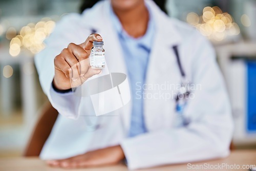 Image of Covid, vaccine and doctor hands for healthcare solution, compliance and policy in office bokeh. Hospital, clinic or pharmacy professional with corona virus in liquid container or product background